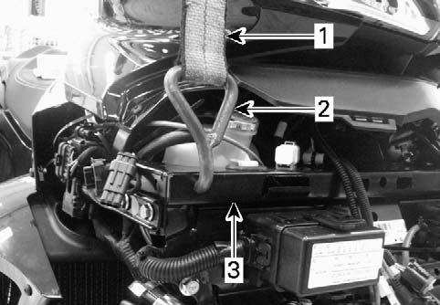 Alternate Method Never lift vehicle by the suspension 1. Install proper straps with hooks on RH and LH lateral supports of vehicle. NOTE: Insert hooks through the holes in the frame.