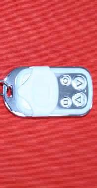 Roller Garage Door PROGRAMMING REMOTE CONTROL HANDSETS AND PUSH BUTTON 1 Slide the white cover down on the remote control handset and you will see there are four buttons (fig 7.1).