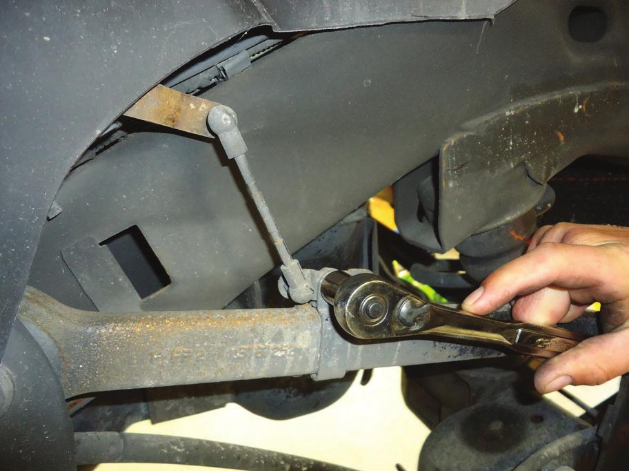 REMOVE THE LOWER SHOCK MOUNTING BOLTS.