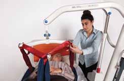 This allows the main body of the sling to slide down the patient s back and be positioned around the legs.