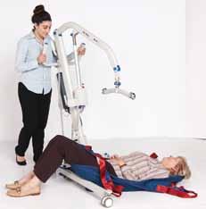 Roll the patient over the sling onto their back and retrieve all sling corner sections from both sides of the patient. Carefully approach the patient with the lifter legs widened as far as possible.
