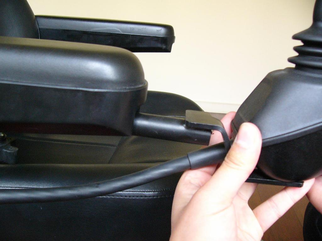 ASSEMBLY CONTINUED Figure 7 Loosen the set knob located underneath the arm rest and then insert the