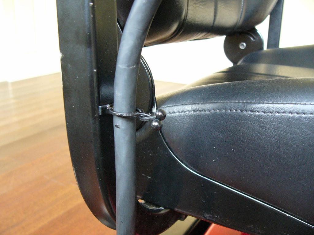 Figure 7 Figure 8 Align the joystick cable underneath the arm rest and feed the cable through the eye