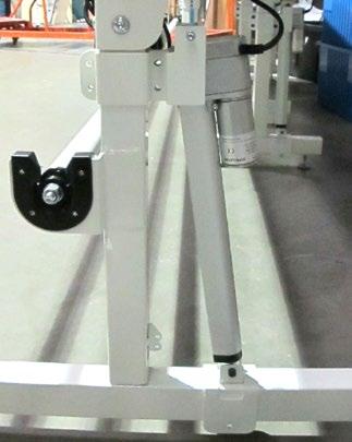 Place the bottom saddle bracket over the inside bottom frame tube with the motor side of the actuator facing away from the leg.