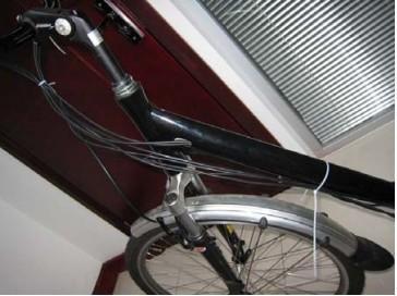 It is advisable to use cable ties to secure the cables to your bicycle frame. Perhaps you find a way to tie them, so that they are almost invisible.