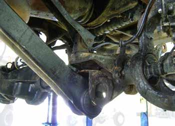 Remove the lower control arm to axle bolts. 6 h.