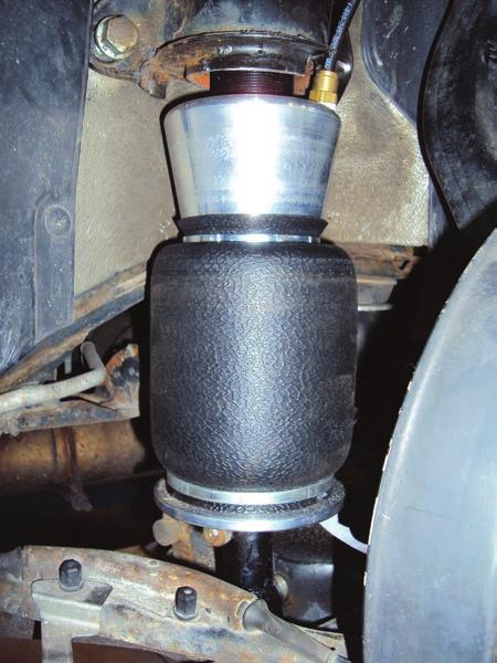 Installing the Air Suspension NOTE Due to the inverted nature of the air spring, it is recommended to periodically clean (once every two months) the rolling lobe end cap of debris that may have