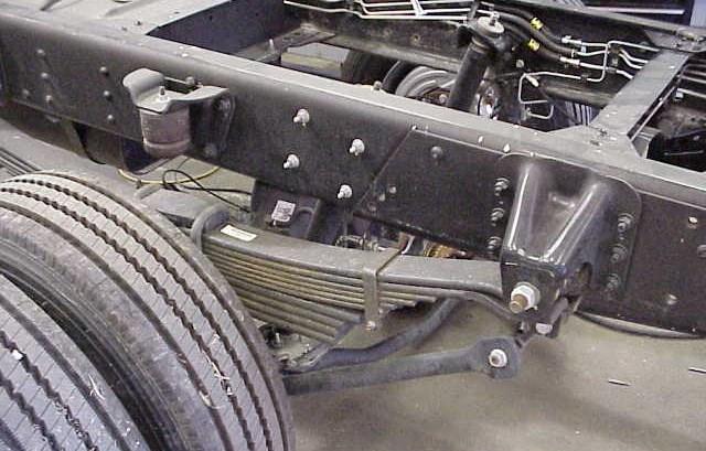 2. DRIVER SIDE DISASSEMBLY 1. With weight taken off the rear springs, as noted in pre-installation checklist, remove the rear bolts from the rear leaf spring hanger bracket.