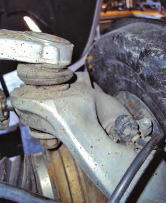 5. Reinstall the upper control arm ball joint into the axle carrier (fig. 14). Torque to 70Nm (52ft lbs). 6. Reattach the headlight control link (fig. 15). Torque to 5.4Nm (48in lbs). fig. 14 fig.