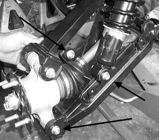 12. Disconnect the lower portion of the shock, the lower bolt from the knuckle assembly, and the rear