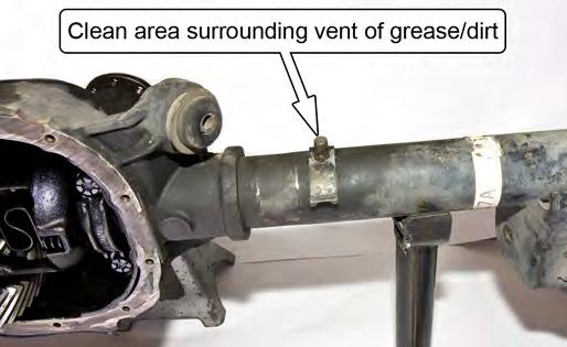 Open up one of the provided hose clamps and pass the end through the slot in one of the Brake Hose Mounting Brackets as shown below. 1.