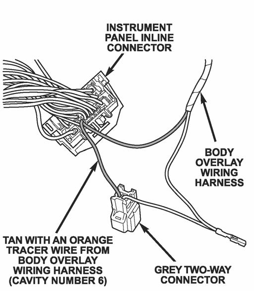 Insert the tan with an orange tracer wire from the overlay harness into the instrument panel inline