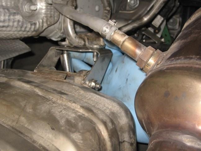 Remove center muffler from vehicle. (See Fig.