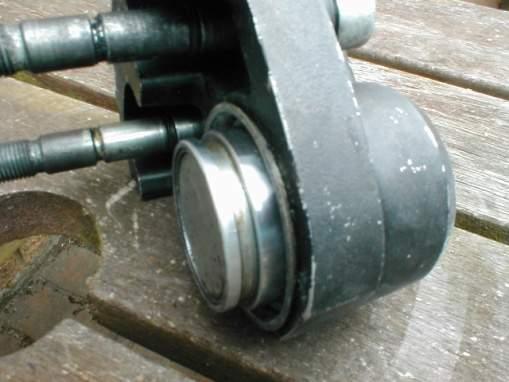 If the piston can be moved and you are going to replace it anyway, pull off the rubber dust cover and you might be able to lever it out so far being careful not to damage the Calliper body, then