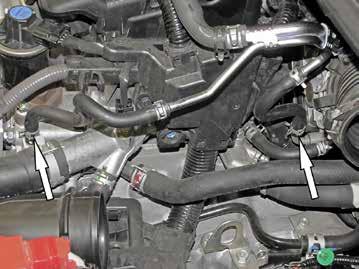 Install the provided coolant by-pass hose and secure with the provided hose clamp. 10.