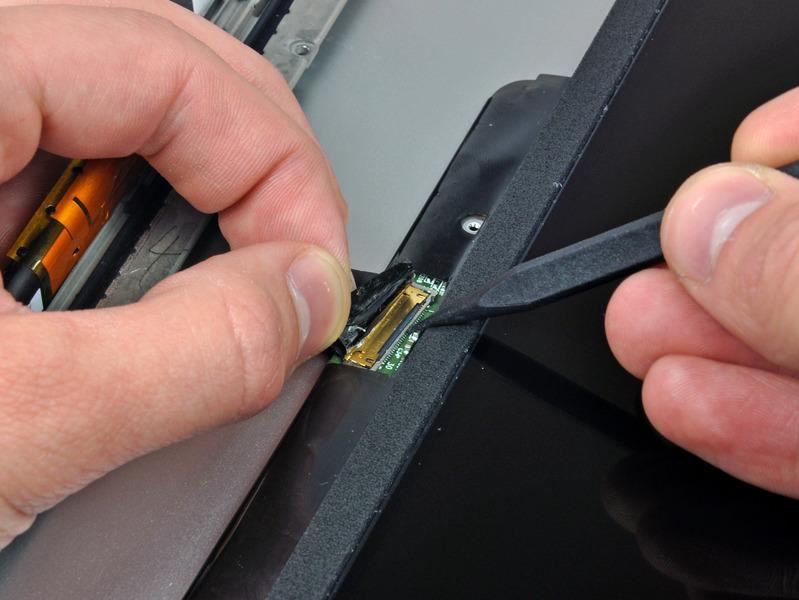 Step 32 Use the tip of a spudger to flip up the thin steel retaining clip securing the display data cable to