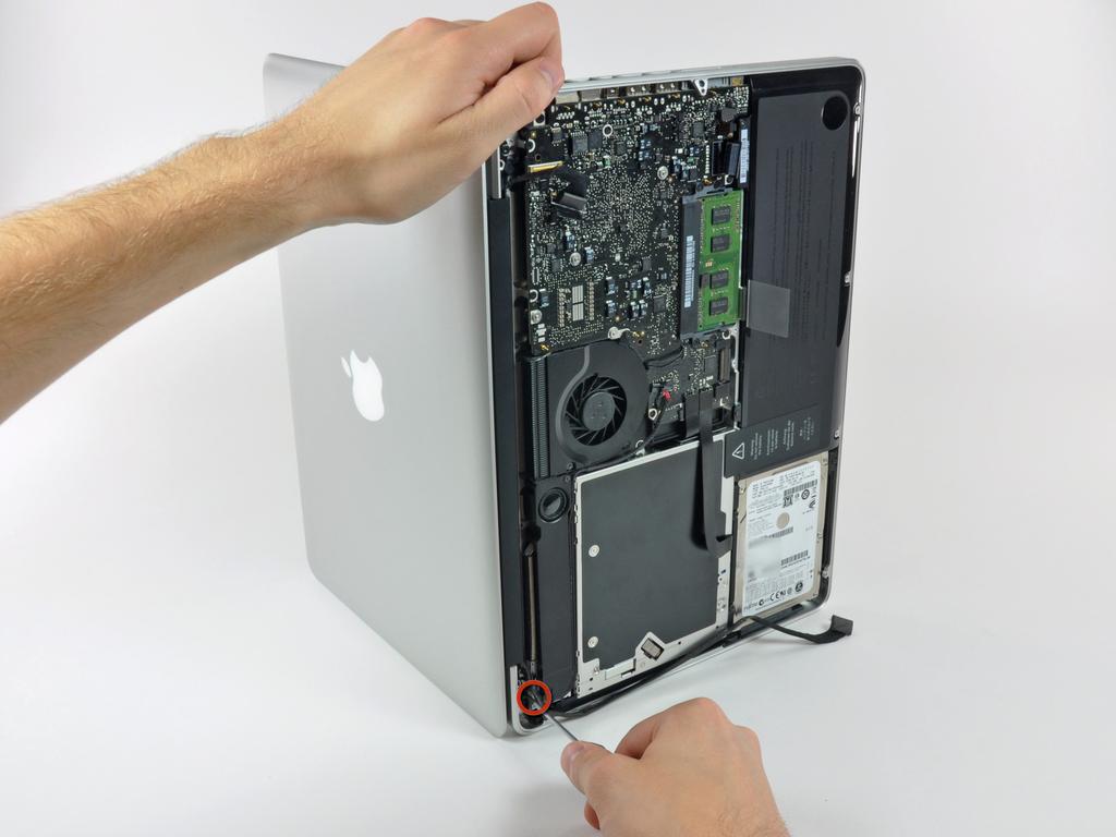 case. Place your opened MacBook on a table as pictured.