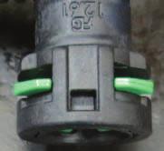 Use an 8mm socket to remove the two bolts retaining the EVAP solenoid then squeeze the tabs to disconnect the EVAP