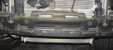 38. Use a panel puller to remove the four pins retaining the foam bumper, then set them and the bumper aside. 41.