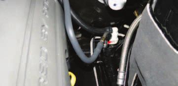 85. Install the supplied EVAP hose on the EVAP solenoid and route it back along the passenger side fuel
