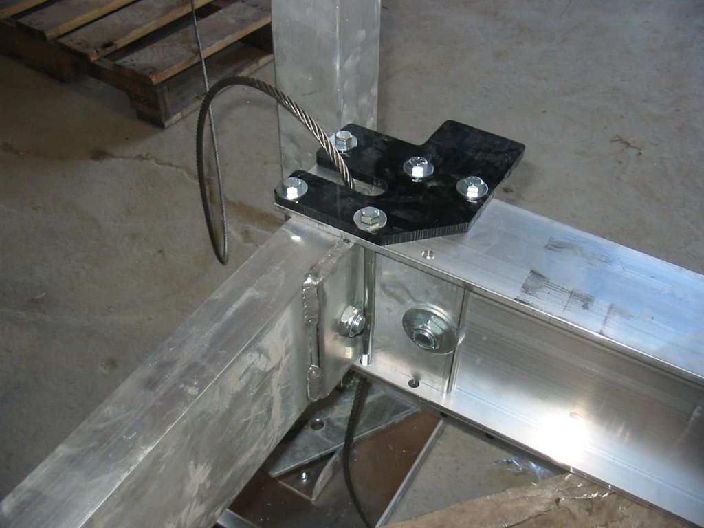 Welded angle clips face inside of hoist. It has 2- cables inside.