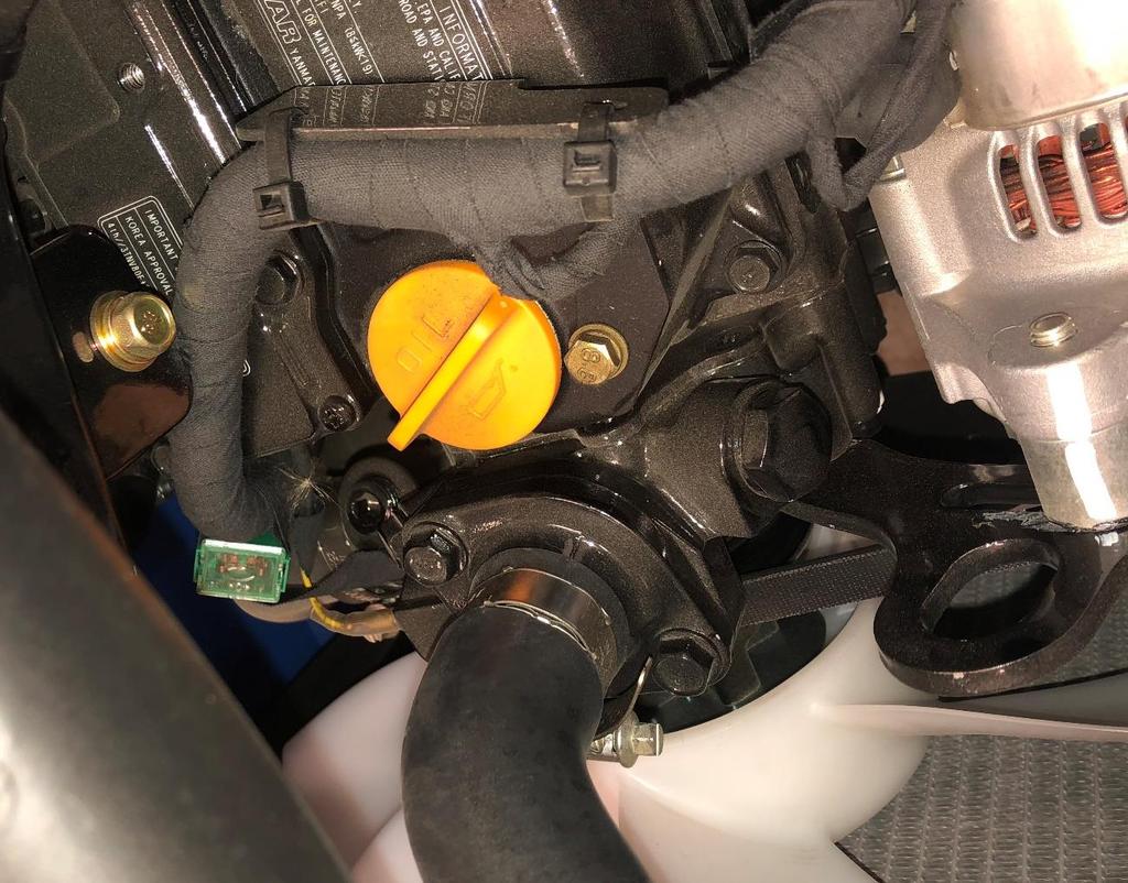 . Take the 3/8NPT x 3/8 barb straight fitting and install into the open port on the LEFT side of the engine. Be sure to use a silicone sealant on the threads of the fitting to prevent water leakage.