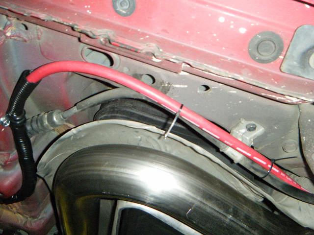 inlet to connect to 5/16 vacuum hose. Route vacuum hose under wiring and E.C.U. cover towards front of car.