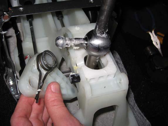 Page 10 21. The plastic triangular side arm and spring can now be removed from the shift assembly.