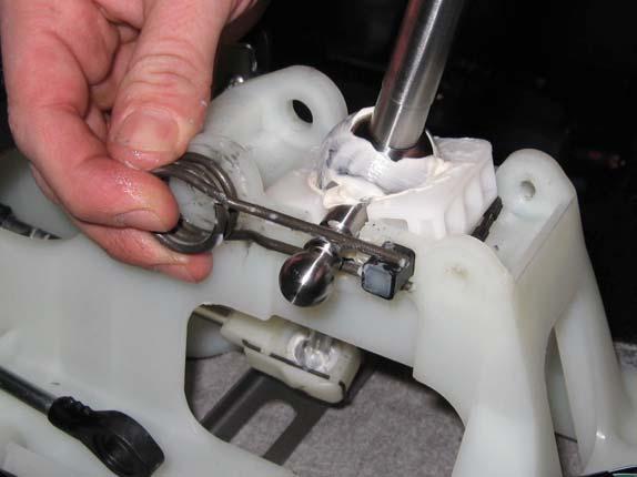 place. Lower the TWM short shifter in to place making sure the bottom rectangular pivot cup with the o-ring is seated properly in the shift assembly.