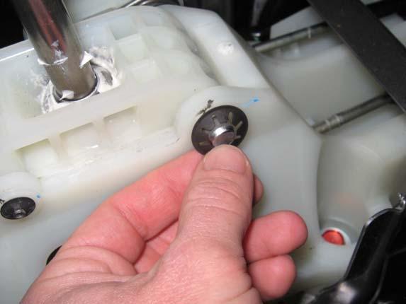 Use a 14mm socket to install the 10mm push clip on the larger pin at the front of the assembly by driving it on with a ratchet