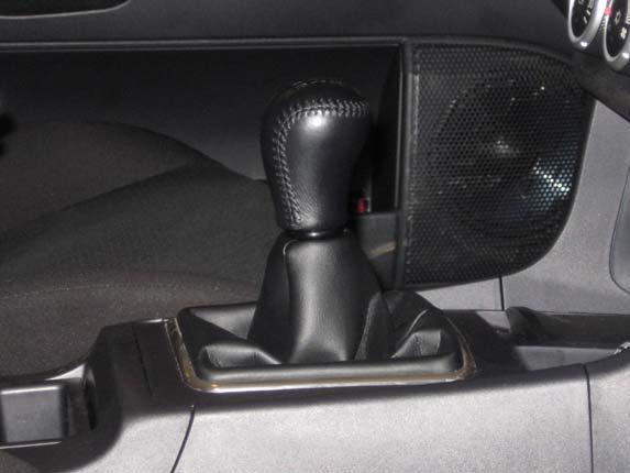 Re-install the center console, re-connect all wires and connectors, and install the shift knob by reversing steps 1 to 14. You are done, enjoy the drive!