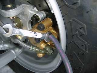 If changing fluid, remove old fluid from reservoir with a Mighty Vacuum or similar tool. NOTE: Do not remove brake lever when reservoir fluid level is low.