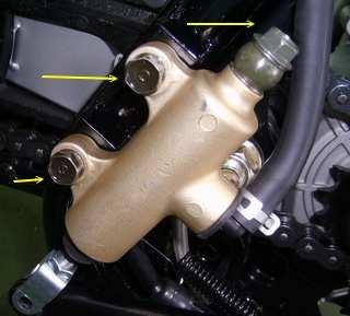 BRAKES 5. Remove 2 master cylinder bolts, banjo bolt and oil tank bolt. 2. Add brake fluid to the upper level mark on reservoir.