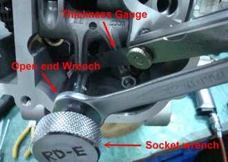 When clearance is correct, hold adjuster screw and tighten locknut securely. 6. Re-check the valve clearance. 7. Repeat steps 3-5 to adjust the exhaust valve clearance. Valve Clearance In: 0.