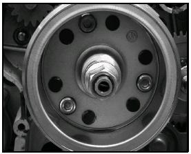 Repeat adjustment procedure if necessary until clearance is correct with locknut secured. FLYWHEEL INSTALLATION 1. Install flywheel key, flywheel washer, and nut. Torque flywheel nut to specification.