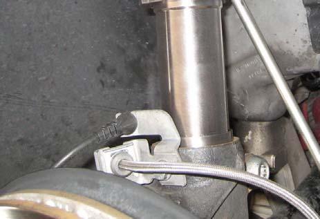 Secure the brake line to the OE bracket, then, reconnect the secondary