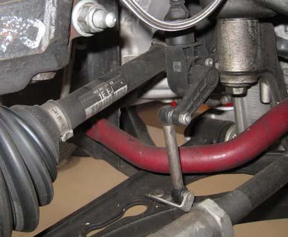 Secure the tie rod to the hub using the OE nut. Photo 13 Photo 11 21.