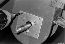 Figure 23. Drilling holes for Elevator Lower Adjuster Figure 24.