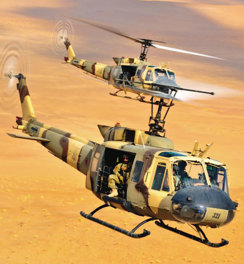 U.S. State Department Huey II helicopters fly hot/high