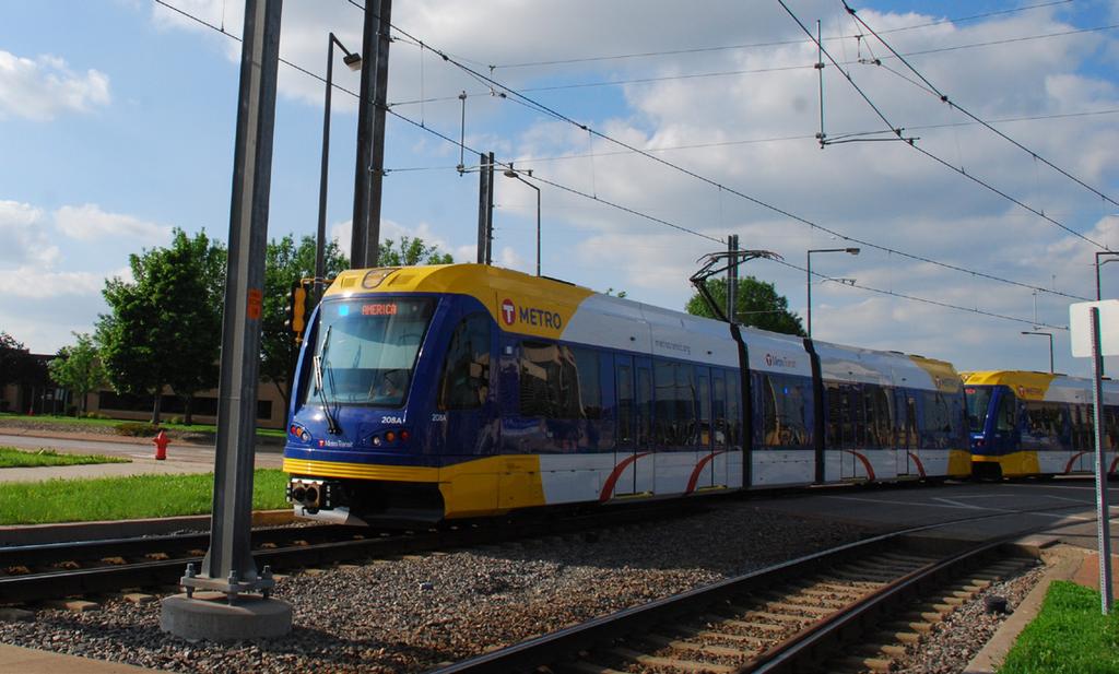 They operate on dedicated light rail tracks, which may be located along streets or in the center of streets in urban areas.