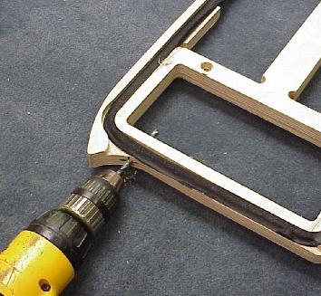3) Drill hole through deck. a. For the regular ESR750 model, drill through the deck as shown.