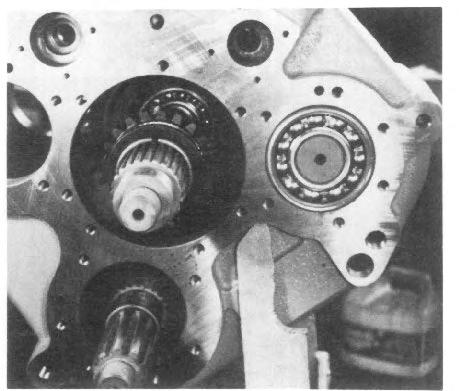 Screw tool and shaft together (See Fig. 23 and 24). Pull shaft through bearings.