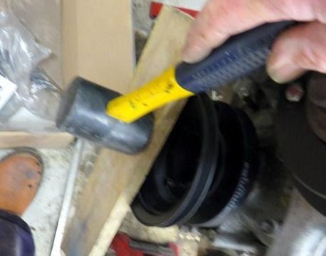 Fitting the crankshaft pulley. It needed a bit of gentle persuasion to fit it snugly into place.