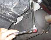 B NOTE: Support the underside of the factory rear mufflers at this time using adjustable support stands (or
