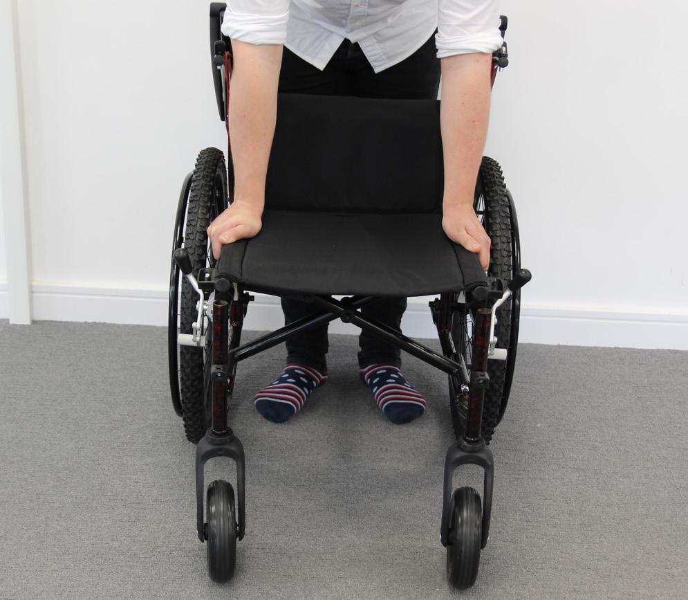7. COMPONENTS / ADJUSTMENTS Unfolding The Wheelchair To unfold the wheelchair, you first have to stand in front of the wheelchair; Now, press on the seat tubes either side of the seat canvas, to
