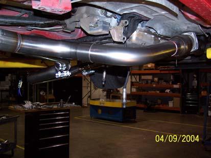 Slip a stainless steel band clamp over the inlet to the passenger side exhaust tube and slip on a catalytic converter.