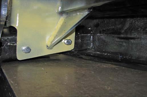 17. Using a 13/32 drill bit, drill the inner two (2) holes in the baseplate thru the bumper.