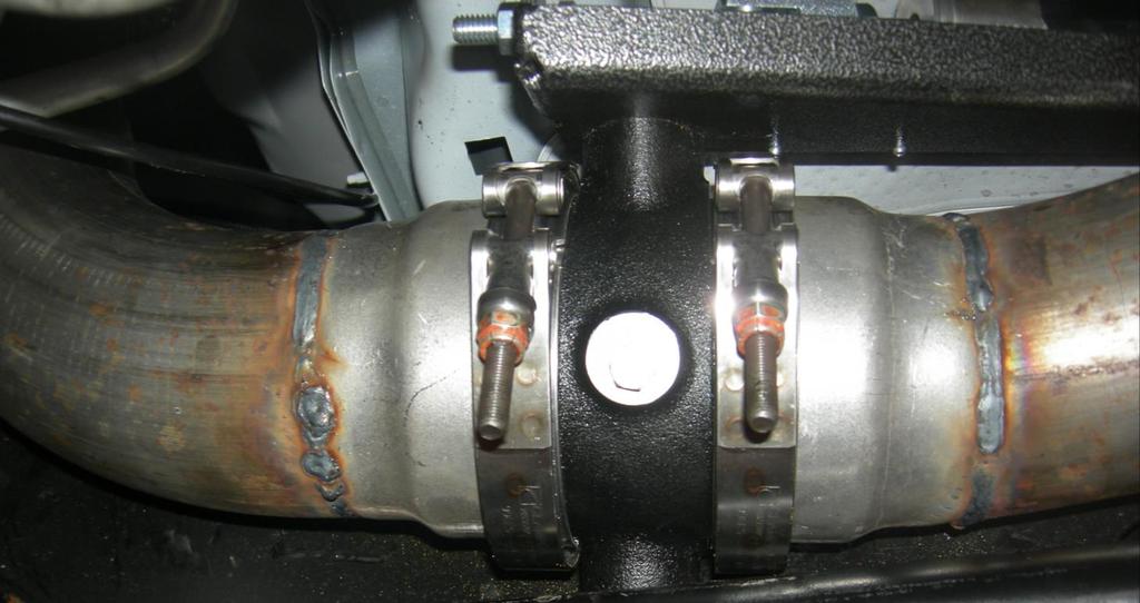 There is an arrow cast into the exhaust brake indicating direction of exhaust flow.
