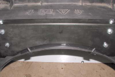 i. Using kit bracket, upper fan shroud (center) as template, drill