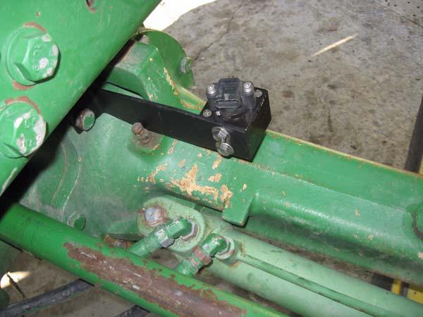 Retighten the bolt so that the bracket that attaches to the Wheel Angle Sensor is perpendicular to the ground.